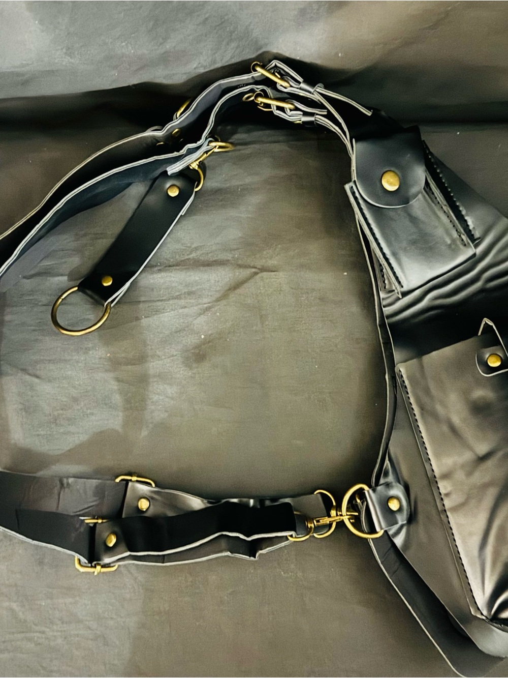 Black Leather Crossbody Harness Bag with Gold Hardware